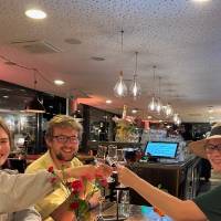 Students and faculty clinking glasses